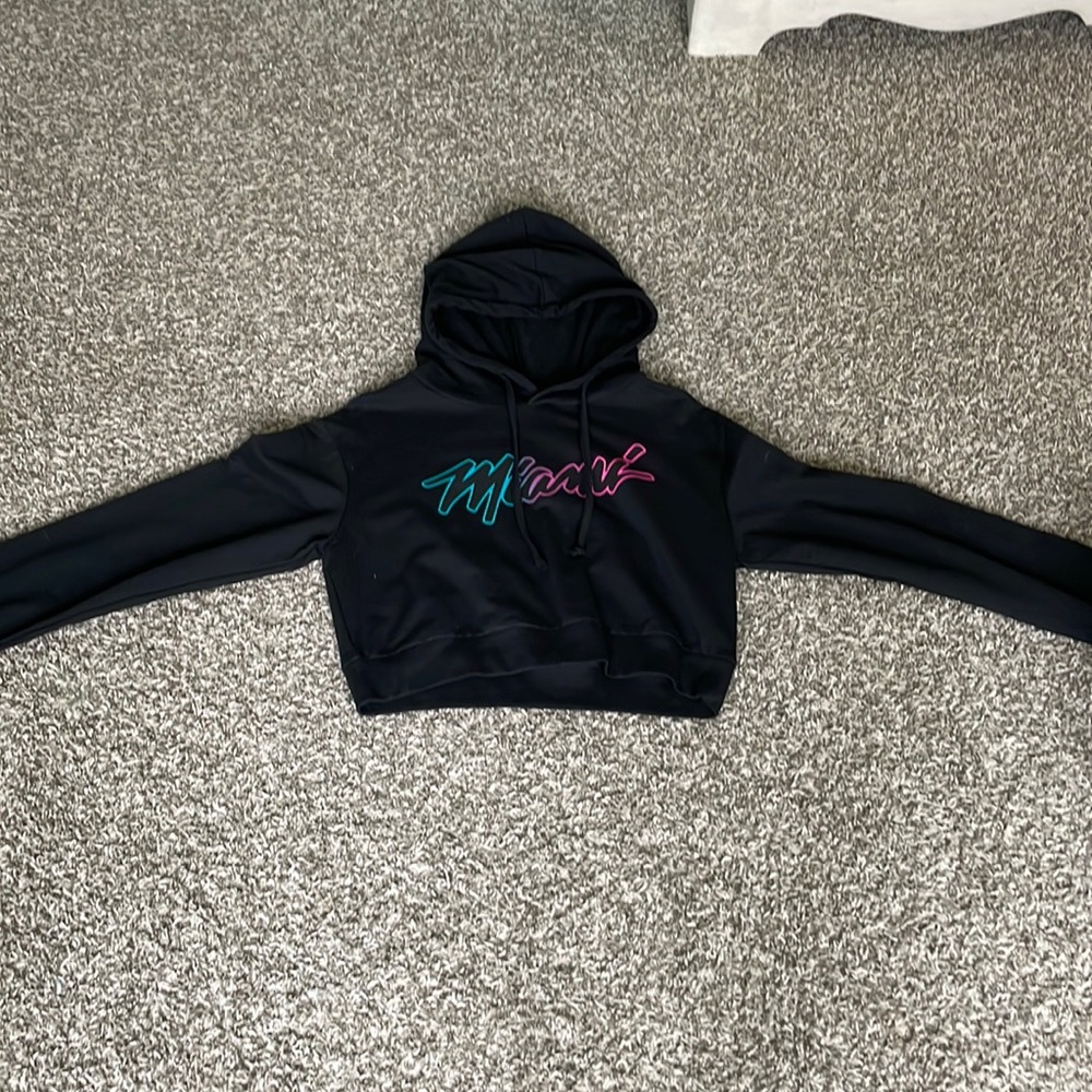 His is a cropped sweat shirt with a hood! Super comfortable and not to showy!